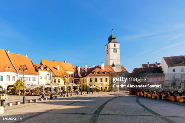 small square (piata mica) in sibiu on a sunny day, transylvania, romania - transylvania stock pictures, royalty-free photos & images