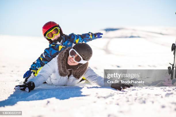 skiing family having fun on winter day - funny snow skiing stock pictures, royalty-free photos & images