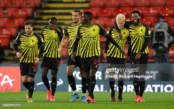 Will Hughes of Watford celebrates with teammates after scoring his team's second goal during the Sky Bet Championship match between Watford and Derby...