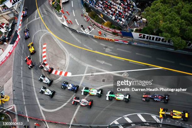 Australian Red Bull Racing Formula One driver Mark Webber driving his RB6 racing car leads the field of cars and drivers through Sainte Devote corner...