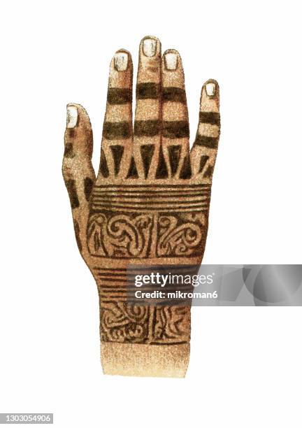 old engraved illustration of native tattoos, hand of a dayak of borneo - henna hands photos et images de collection