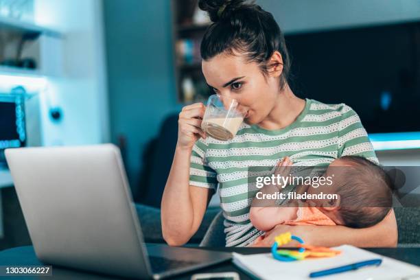 working at home mom - breastfeeding stock pictures, royalty-free photos & images