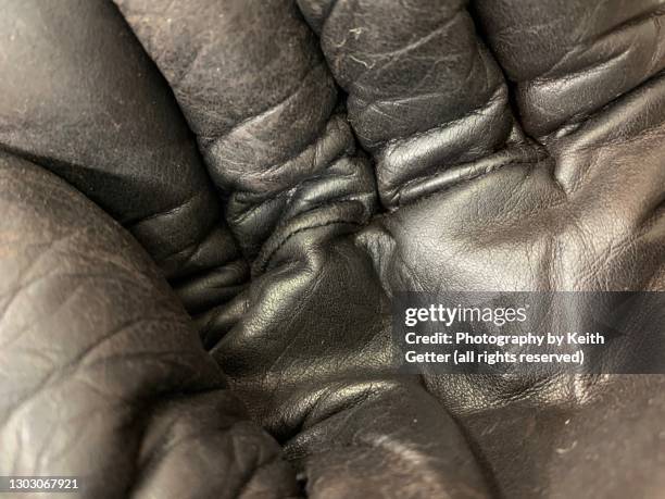 abstract background: a hand glove close-up - guanto di pelle foto e immagini stock