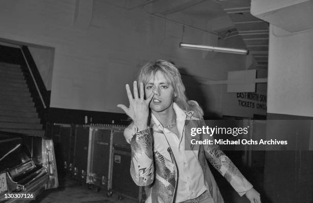 Drummer Roger Taylor of British rock band Queen, backstage, circa 1977.