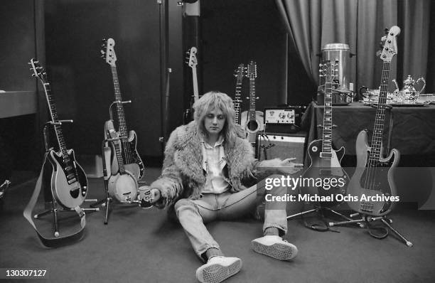 Drummer Roger Taylor of British rock band Queen, backstage during the band's US tour, 1977.