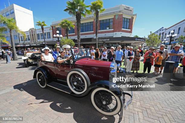 Vintage cars parade down Emerson Street as thousands of people turn out to celebrate Art Deco on February 20, 2021 in Napier, New Zealand, even...