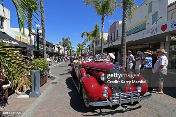 Vintage cars parade down Emerson Street as thousands of people turn out to celebrate Art Deco on February 20, 2021 in Napier, New Zealand, even...