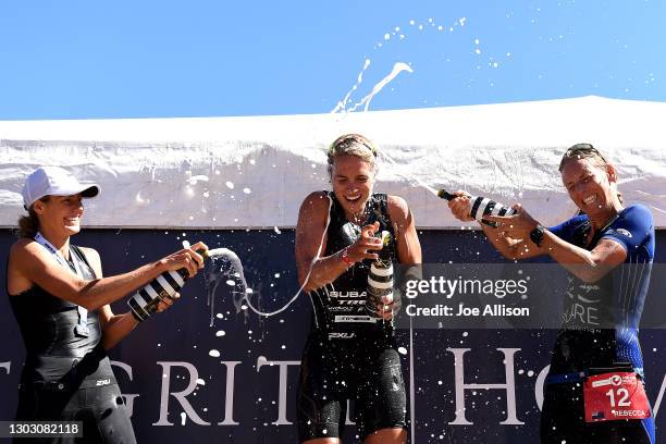 Maeve Kennedy-Birdsall, Hannah Wells and Rebecca Clarke celebrate on the podium during Challenge Wanaka on February 20, 2021 in Wanaka, New Zealand.