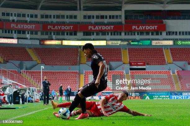Jesus Gallardo of Monterrey fights for the ball with Juan Delgado of Necaxa during the 7th round match between Necaxa and Monterrey as part of the...