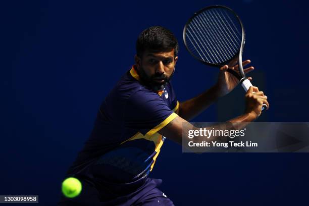 Rohan Bopanna of India plays a backhand in his Men's Singles qualifying match against Christopher Eubanks of the United States during the Singapore...