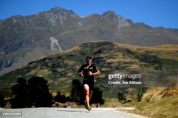 Competitor competes in the run leg during Challenge Wanaka on February 20, 2021 in Wanaka, New Zealand.