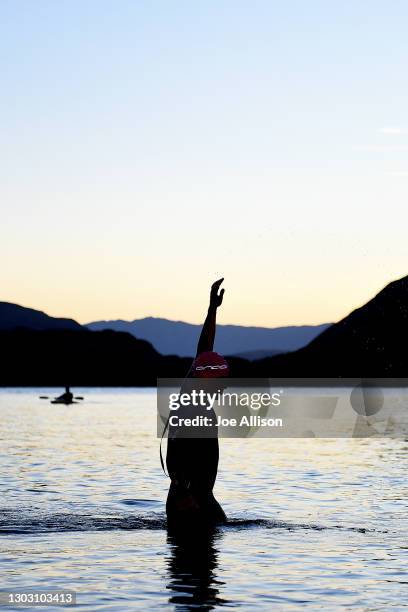 Competitor warms up ahead of the swim leg during Challenge Wanaka on February 20, 2021 in Wanaka, New Zealand.