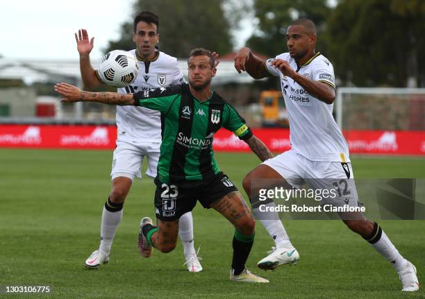 Alessandro Diamanti of Western United is challenged by Benat Etxebarria and James Meredith of Macarthur FC during the A-League match between Western...