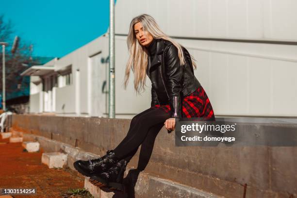 street-styled young woman on a sunny winter day in the city - leather skirt stock pictures, royalty-free photos & images