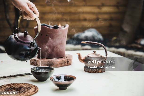 beautiful and exquisite chinese tea ceremony- boiling the water for making tea in a traditional charcoal stove - 中国茶 ストックフォトと画像