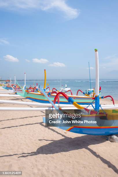 traditional fishing boats on the beach. sanur. bali. indonesia. - sanur stock pictures, royalty-free photos & images