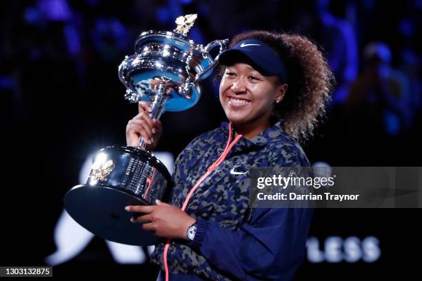 Naomi Osaka of Japan poses with the Daphne Akhurst Memorial Cup after winning her Women’s Singles Final match against Jennifer Brady of the United...