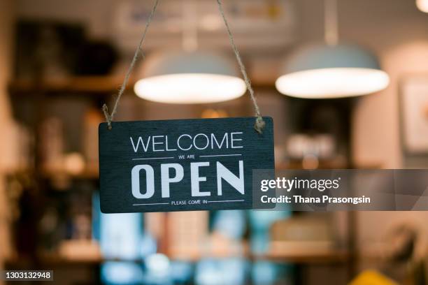 open sign on cafe hang on door at entrance - door sign stock pictures, royalty-free photos & images