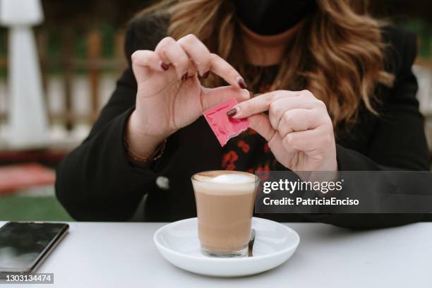 young woman having a coffee - artificial sweetener stock pictures, royalty-free photos & images