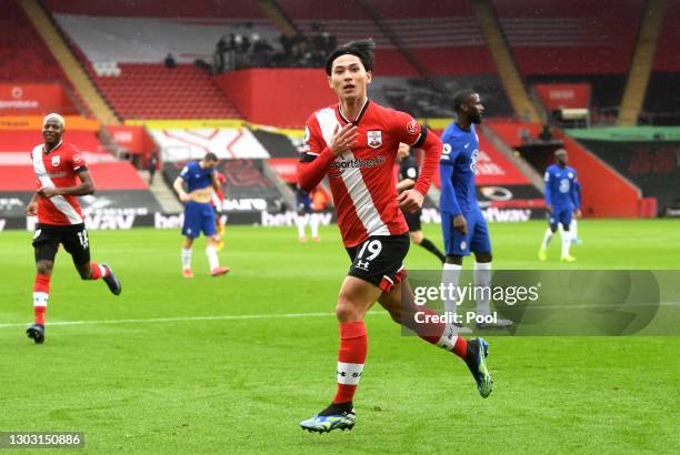 Takumi Minamino of Southampton celebrates after scoring his team's first goal during the Premier League match between Southampton and Chelsea at St...