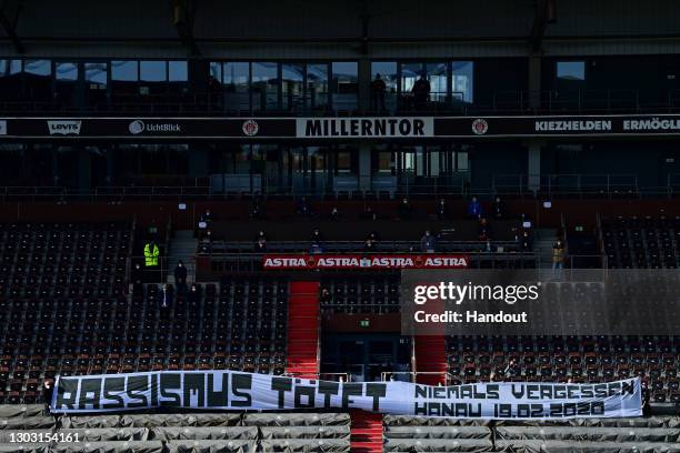 In this handout image provided by Witters Sportfotografie, banners are seen in the stands to commemorate the victims of the Hanau shooting prior to...