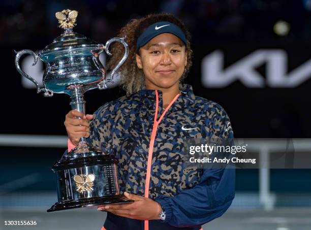 Naomi Osaka of Japan poses with the Daphne Akhurst Memorial Cup after winning her Women’s Singles Final match against Jennifer Brady of the United...