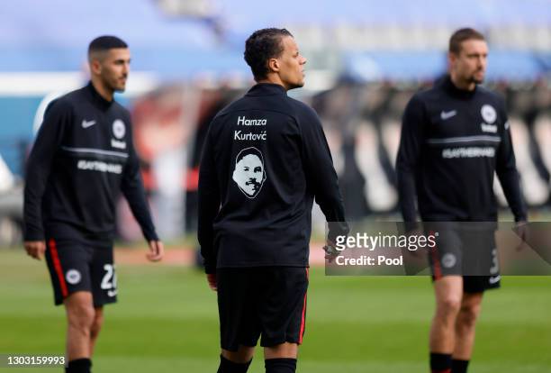 Timothy Chandler of Eintracht Frankfurt wears a shirt during his warm up with the name of Hamza Kurtovic on his back who was one of the victims of...