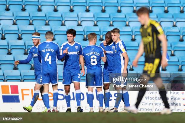 John Akinde of Gillingham FC celebrates with Kyle Dempsey and Jack Tucker after scoring his sides second goal during the Sky Bet League One match...