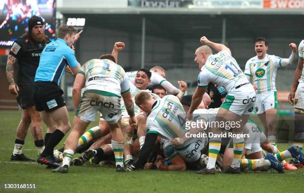 Northampton Saints players celebrate after scoring the first try through forward Shaun Adendorff during the Gallagher Premiership Rugby match between...