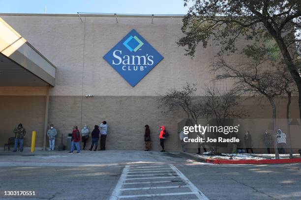 People wait for the Sam's Club store to open as they look to purchase essentials on February 20, 2021 in Austin, Texas. Winter storm Uri disrupted...