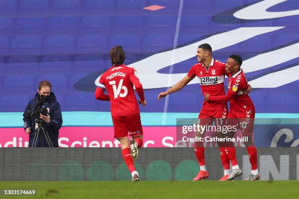 Ashley Fletcher of Middlesbrough celebrates with team mates Darnell Fisher and Jonny Howson after scoring their side's first goal during the Sky Bet...