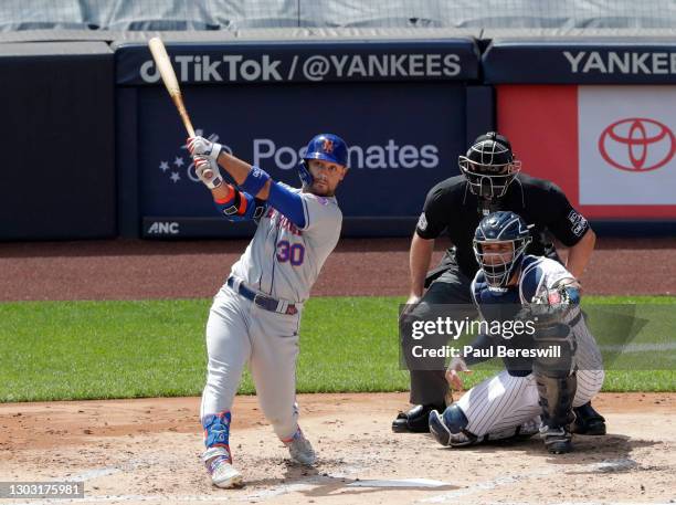 August 30: Michael Conforto of the New York Mets hits a long fly ball in game 1 of an interleague MLB baseball doubleheader as umpire Chris Conway...