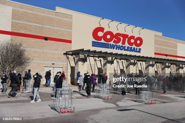 People wait to shop at the Costco as they look to purchase essentials on February 20, 2021 in Austin, Texas. Winter storm Uri disrupted the supply...