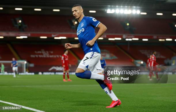 Richarlison of Everton celebrates after scoring his team's first goal during the Premier League match between Liverpool and Everton at Anfield on...
