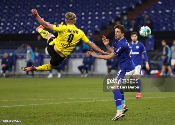 Erling Haaland of Borussia Dortmund scores his team's second goal during the Bundesliga match between FC Schalke 04 and Borussia Dortmund at...
