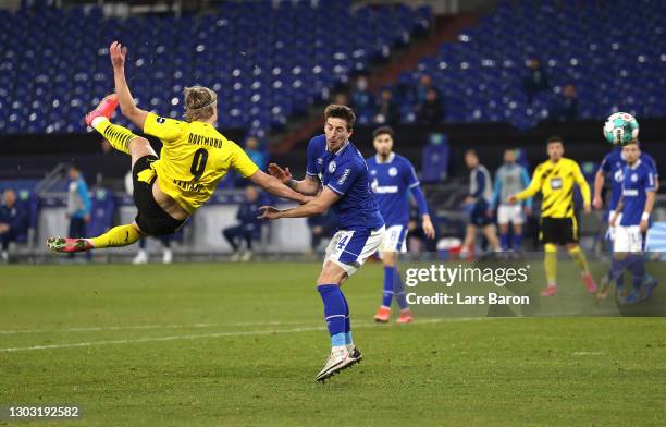 Erling Haaland of Borussia Dortmund scores his team's second goal during the Bundesliga match between FC Schalke 04 and Borussia Dortmund at...