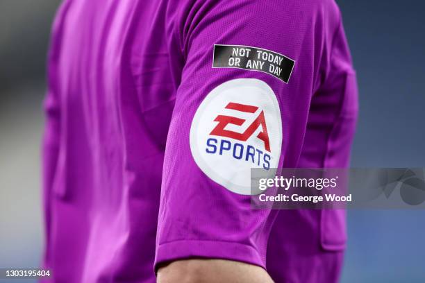 Detailed view of the anti racism message, "Not today or any day" above the EA Sports sleeve badge on the Lines Official's shirt during the Sky Bet...