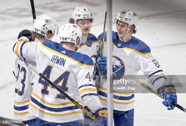 Matt Irwin of the Buffalo Sabres is congratulated by teammates Sam Reinhart,Jack Eichel and Victor Olofsson of the Buffalo Sabres after Irwin scored...