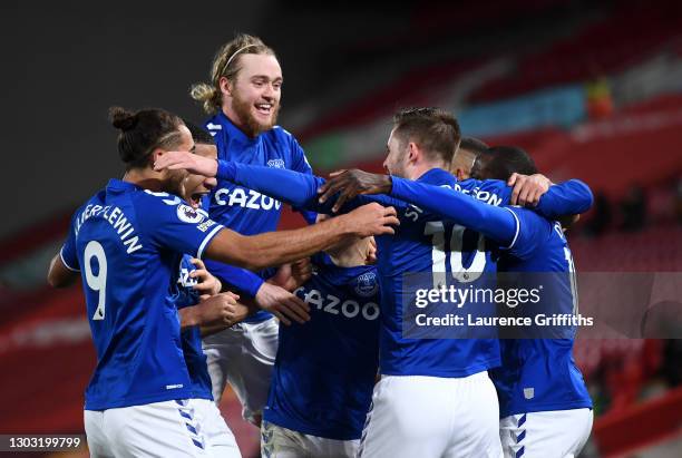 Gylfi Sigurdsson of Everton celebrates with teammates Dominic Calvert-Lewin, Tom Davies, and Abdoulaye Doucoure after scoring his team's second goal...