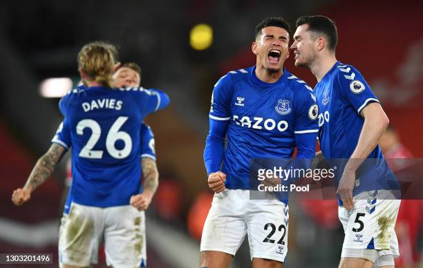 Ben Godfrey and Michael Keane of Everton celebrate following their team's victory in the Premier League match between Liverpool and Everton at...