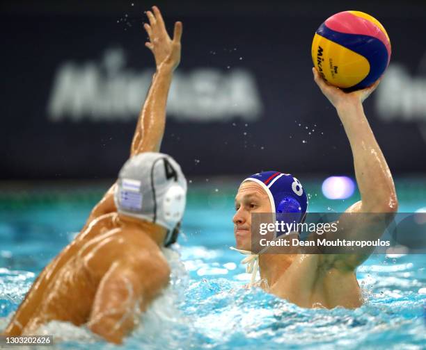 Ivan Nagaev of Russia battles for the ball with Marios Kapotsis of Greece during Day 7 of the FINA Men's Water Polo Olympic Games Qualification...