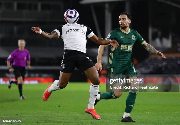 Ivan Cavaleiro of Fulham controls the ball whilst under pressure from Kean Bryan of Sheffield United during the Premier League match between Fulham...