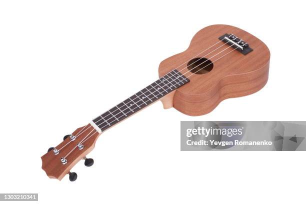 brown ukulele guitar isolated on the white background - acoustic guitar white background stock pictures, royalty-free photos & images