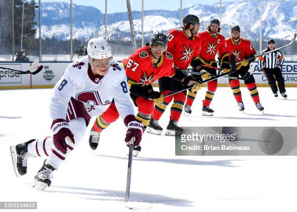 Cale Makar of the Colorado Avalanche skates with the puck away from Max Pacioretty and the Vegas Golden Knights during the first period of the 2021...