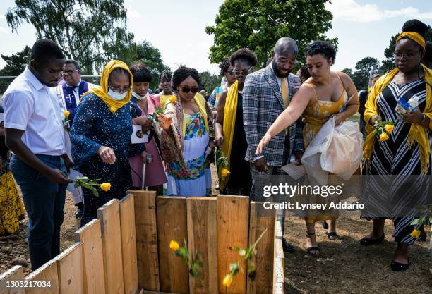 Samuel Akinsanya, center right, his partner, Rebekah Anderson, and his aunt Mary Idowu second from left, are joined by a small group of loved ones as...