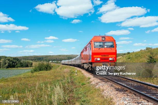 powerful diesel locomotive with passenger train - passenger train stock pictures, royalty-free photos & images
