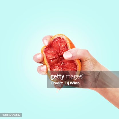 Hand Squeezing Grapefruit Hand Squeezing Grapefruit