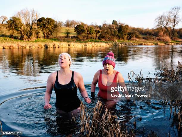 open water river swimmers - 35 female outdoors stock-fotos und bilder