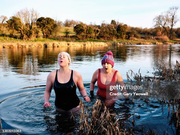 open water river swimmers - healthy lifestyle winter stock pictures, royalty-free photos & images