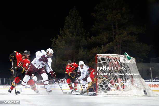 Pierre-Edouard Bellemare and Gabriel Landeskog of the Colorado Avalanche are stopped by Marc-Andre Fleury of the Vegas Golden Knights during the...